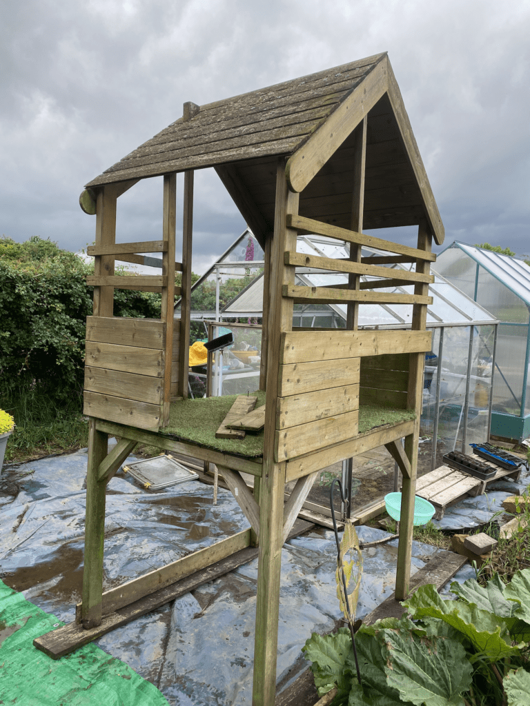 Second hand, barewood, children's playhouse waiting to be given some tlc.