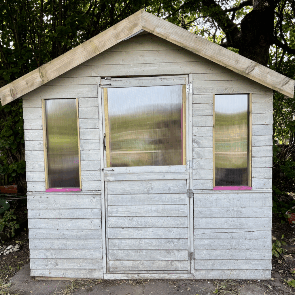 Shed with new windows made from polycarbonate sheeting. New eye and hook latches top and bottom of the central door too.